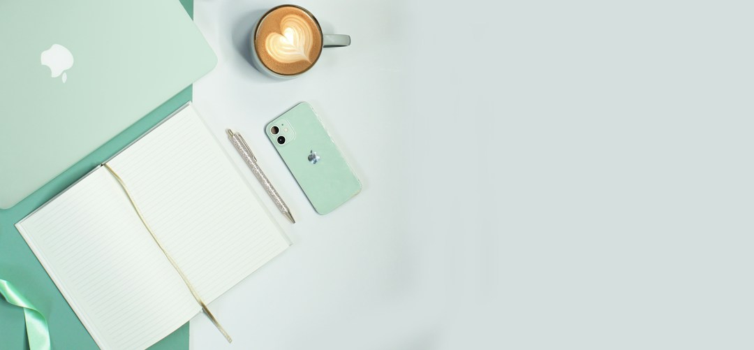 Creative flat lay with coffee, camera, notebook and everyday objects