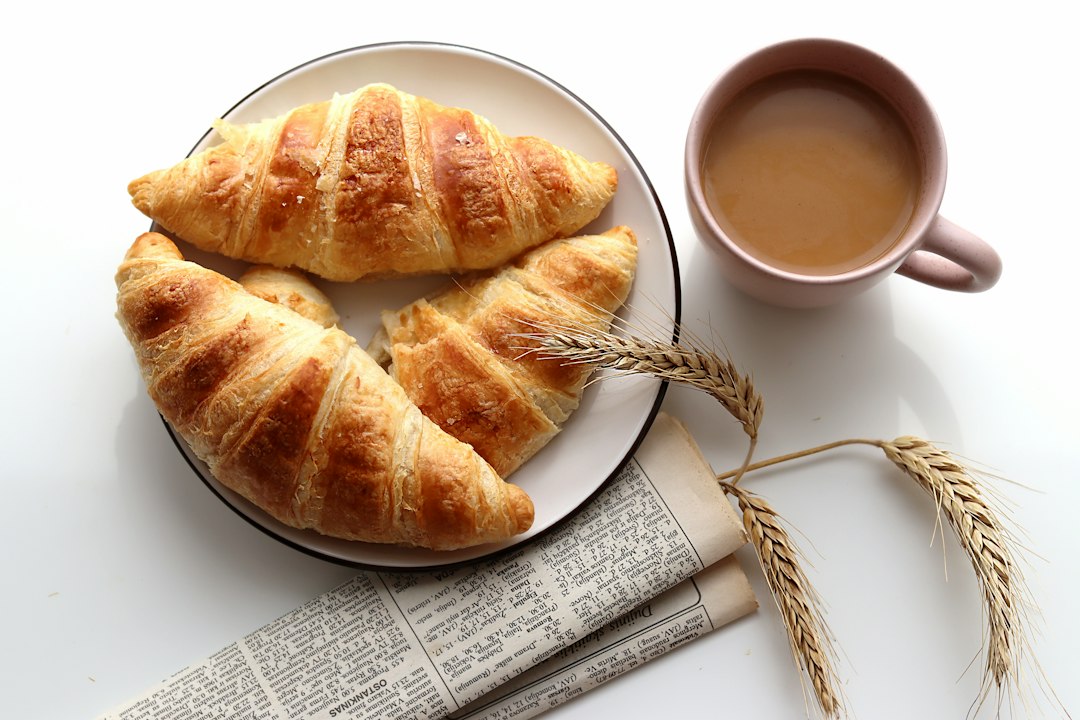 Coffee and croissant on a table