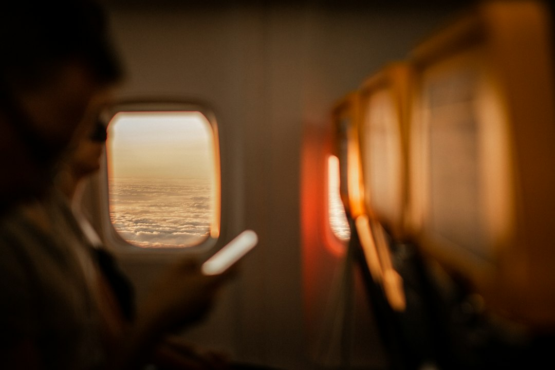 Airplane window at sunset